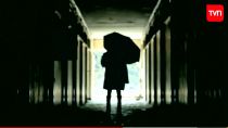 The man with the umbrella.