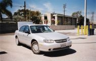 The automobile (A Chevrolet Malibu), located at the Enterprise Rent-A-Car at LAX Airport, being picked up.